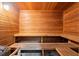Spacious wooden sauna room with wooden benches and wood-burning heater at 980 Pine Grove Rd, Roswell, GA 30075