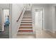Open staircase with wood steps and access to the gym at 980 Pine Grove Rd, Roswell, GA 30075