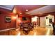 Basement entertainment room with seating area and table, with an adjacent workout area at 102 Cavit Ct, Canton, GA 30114