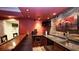 Basement bar with custom wood counters, stone backsplash, stainless sink, and wine cooler at 102 Cavit Ct, Canton, GA 30114