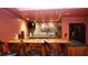 Custom basement bar with wood counter, stone backsplash, and convenient wine storage at 102 Cavit Ct, Canton, GA 30114