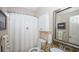 Bathroom with granite vanity, framed mirror, and a shower/tub combination with white shower curtain at 102 Cavit Ct, Canton, GA 30114