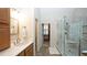 Bathroom featuring glass walk-in shower and vanity with countertop at 102 Cavit Ct, Canton, GA 30114