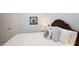 Bedroom featuring a plush bed with decorative pillows and a floral print above the bed at 102 Cavit Ct, Canton, GA 30114