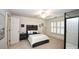 Bedroom with wood-slat headboard, ceiling fan, and plantation shutters at 102 Cavit Ct, Canton, GA 30114