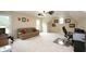Spacious bonus room with natural light, carpeting, and ceiling fans at 102 Cavit Ct, Canton, GA 30114