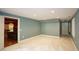 Large, versatile room with plush carpeting, offering access to an entertainment area and ample closet space at 102 Cavit Ct, Canton, GA 30114