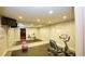 Home gym featuring mirrored walls, rubber flooring, and updated equipment at 102 Cavit Ct, Canton, GA 30114