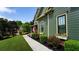 Beautiful home exterior with lush lawn, landscaping, and an American flag at 102 Cavit Ct, Canton, GA 30114