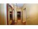 Hallway with decorative mirror panel doors and hardwood floors leading to the movie theater at 102 Cavit Ct, Canton, GA 30114