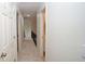Carpeted hallway with access to all bedrooms and bathrooms on the second floor at 102 Cavit Ct, Canton, GA 30114