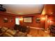 Basement home theater boasts comfortable seating, movie screen, and recessed lighting at 102 Cavit Ct, Canton, GA 30114