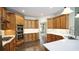 Gourmet kitchen featuring stainless steel appliances, a gas cooktop, and white countertops at 102 Cavit Ct, Canton, GA 30114
