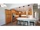 Bright kitchen featuring wooden cabinets, a white countertop island with stools and stainless steel appliances at 102 Cavit Ct, Canton, GA 30114