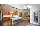 Spacious kitchen with an island, quartz countertops and stainless steel appliances and view into the living area at 102 Cavit Ct, Canton, GA 30114