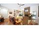 Spacious living room boasts a stone fireplace, built-in shelving, and hardwood floors, ideal for Gathering gatherings at 102 Cavit Ct, Canton, GA 30114