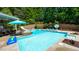 Sparkling swimming pool with slide, hot tub, and plenty of room for lounging at 102 Cavit Ct, Canton, GA 30114