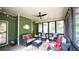 Inviting screened-in porch with casual seating and ambient lighting at 102 Cavit Ct, Canton, GA 30114