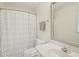 Bathroom featuring a white vanity, toilet, and shower with patterned curtain at 10660 Dunoon Dr, Alpharetta, GA 30022