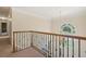 A view of the foyer from the second floor featuring a large arched window and a chandelier at 10660 Dunoon Dr, Alpharetta, GA 30022