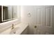 Modern bathroom vanity featuring an illuminated mirror, contemporary faucet and fixtures, and plenty of space at 1199 Ashborough Se Dr # K, Marietta, GA 30067