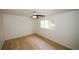 Bedroom with ceiling fan, wood floors, and a window at 1199 Ashborough Se Dr # K, Marietta, GA 30067