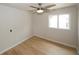 Light-filled bedroom features a modern ceiling fan and a large window at 1199 Ashborough Se Dr # K, Marietta, GA 30067