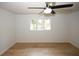 Bedroom with ceiling fan, wood floors, and natural light at 1199 Ashborough Se Dr # K, Marietta, GA 30067