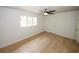 Bedroom with ceiling fan, wood floors, and large window at 1199 Ashborough Se Dr # K, Marietta, GA 30067