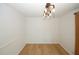 Bright dining room with hardwood floors and stylish lighting fixture at 1199 Ashborough Se Dr # K, Marietta, GA 30067