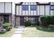 Charming townhome featuring brick and siding, complemented by a well-manicured lawn at 1199 Ashborough Se Dr # K, Marietta, GA 30067