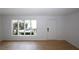 Bright living room featuring wooden floors and a large window with natural light at 1199 Ashborough Se Dr # K, Marietta, GA 30067