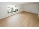 Spacious living room with wooden floors and a large window providing natural light at 1199 Ashborough Se Dr # K, Marietta, GA 30067
