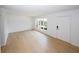 Bright, spacious living room with wooden floors and a large window for ample light at 1199 Ashborough Se Dr # K, Marietta, GA 30067