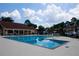 Community pool on a sunny day with lounge chairs and trees in the background at 1199 Ashborough Se Dr # K, Marietta, GA 30067