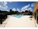 Well-maintained community pool surrounded by lounge chairs and lush landscaping at 1199 Ashborough Se Dr # K, Marietta, GA 30067