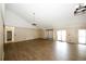 Open recreation room with wood floors, high ceilings, and a sliding glass door at 1199 Ashborough Se Dr # K, Marietta, GA 30067