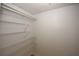 Spacious walk-in closet provides ample storage with wire shelving and a clean, organized layout at 1199 Ashborough Se Dr # K, Marietta, GA 30067