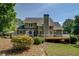 Well-maintained backyard with large deck and lush landscaping features at 1391 Sutters Dr, Lawrenceville, GA 30045