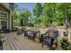 Backyard deck with wicker furniture and an umbrella, perfect for outdoor living and entertaining at 1391 Sutters Dr, Lawrenceville, GA 30045
