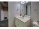 Bathroom features a single sink, mirror, and tile floor, conveniently located near the staircase at 1391 Sutters Dr, Lawrenceville, GA 30045
