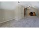 Spacious carpeted bedroom features a closet, ceiling fan, and an attached workspace at 1391 Sutters Dr, Lawrenceville, GA 30045