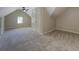 Spacious carpeted bedroom features a ceiling fan, window and a large closet with doors at 1391 Sutters Dr, Lawrenceville, GA 30045