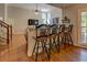 Cozy breakfast bar adjacent to the living room area, offering a convenient dining or entertaining space at 1391 Sutters Dr, Lawrenceville, GA 30045
