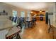 Open-concept dining area with hardwood floors, a breakfast bar, and natural light at 1391 Sutters Dr, Lawrenceville, GA 30045