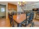Dining room featuring a large table, chandelier, and access to the kitchen at 1391 Sutters Dr, Lawrenceville, GA 30045