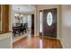 Inviting foyer with hardwood flooring, an elegant front door, and a view of the dining room at 1391 Sutters Dr, Lawrenceville, GA 30045