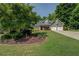 Beautifully landscaped front yard with lush lawn and charming curb appeal at 1391 Sutters Dr, Lawrenceville, GA 30045