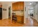 Kitchen features a desk area with built-in cabinets, hardwood floors, and access to the dining room at 1391 Sutters Dr, Lawrenceville, GA 30045