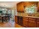 Eat-in kitchen area with breakfast table, stainless steel appliances, granite countertops, and natural lighting at 1391 Sutters Dr, Lawrenceville, GA 30045